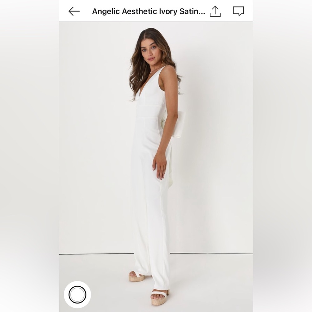 White Lulus jumpsuit with detachable bow.